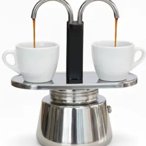 Two modern ceramic cups with freshly brewed coffee beside Brew Grind Supply Co. manual grinder