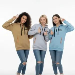 Three women smiling and wearing Jalil unisex multi-pocket hoodies