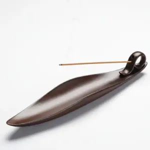 handcrafted zen incense stick holder on white background